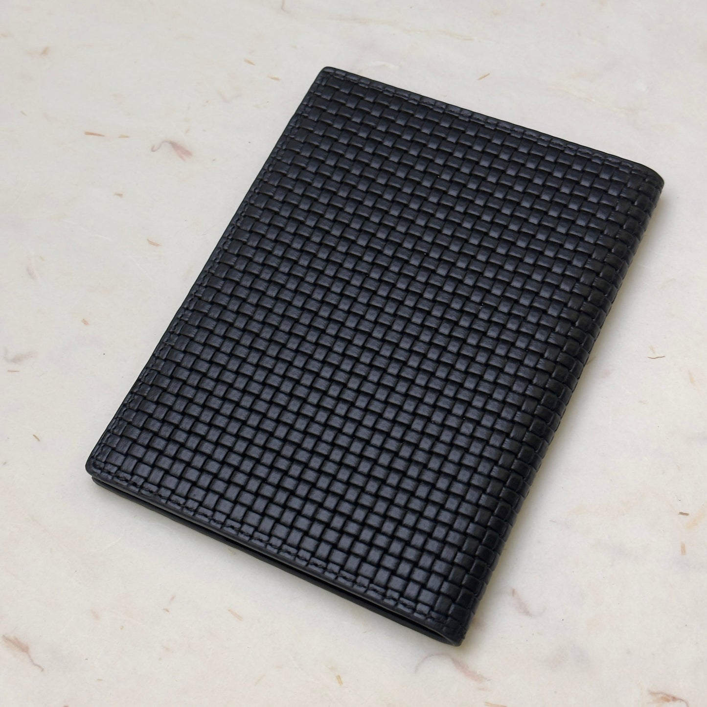 Roger Dubuis Black Leather Passport Holder With Intrecciato Weave Pattern | Luxe Travel Essentials