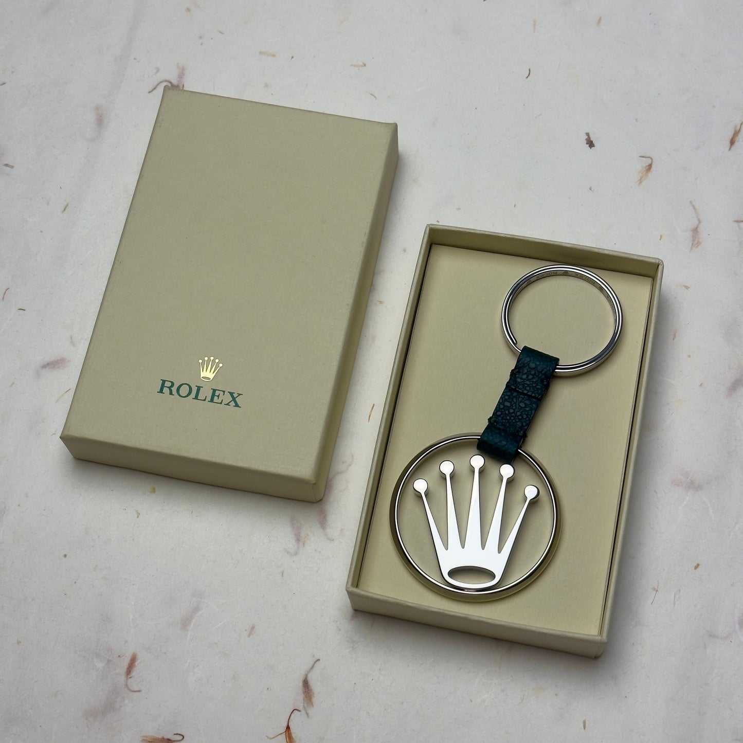 Elegant Silver Crown Logo Rolex Keychain With Green Leather Strap | Luxe Accessories