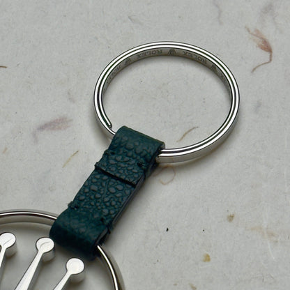 Elegant Silver Crown Logo Rolex Keychain With Green Leather Strap | Luxe Accessories